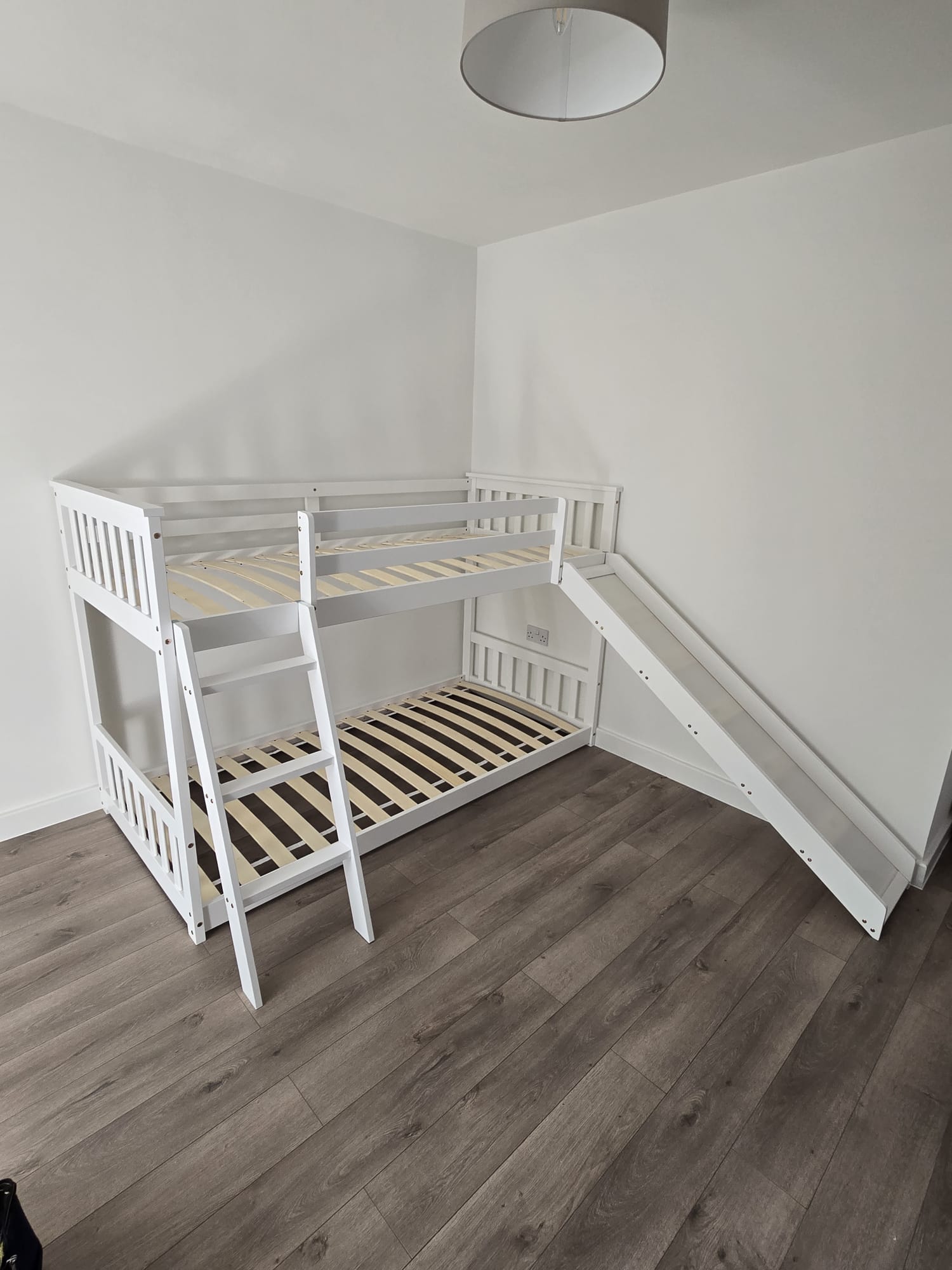 White wooden bunk bed with side slide