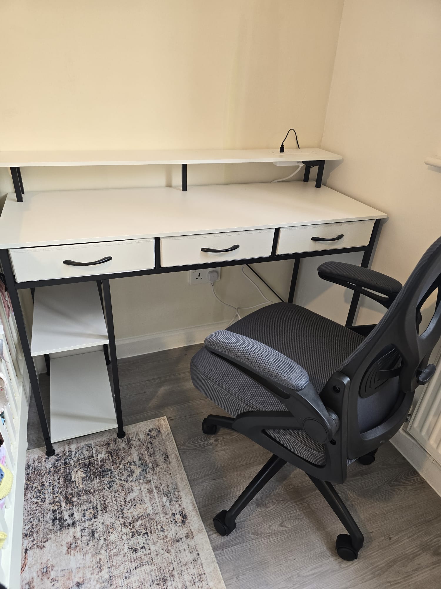 White desk with monitor shelf and office chair
